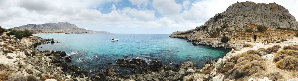 Panoramic view of bay against sky