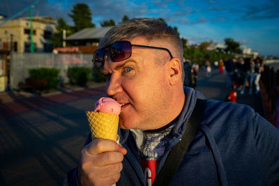 Portrait of young woman ice cream cone