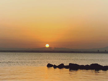 Scenic view of sea against sky during sunset