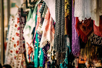 Close-up of clothes hanging in store for sale