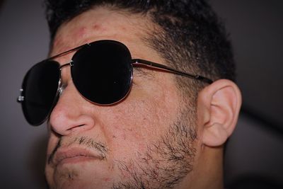 Close-up portrait of man wearing sunglasses