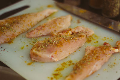 Chicken meat in tray on table