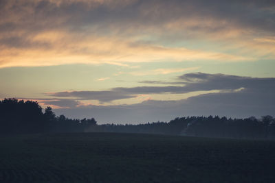 Scenic view of silhouette landscape against sky during sunset