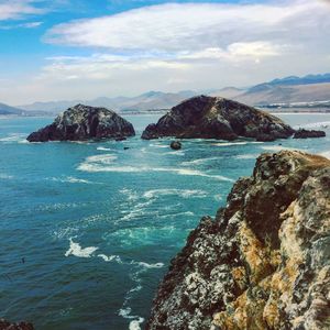 Scenic view of cliffs in the sea