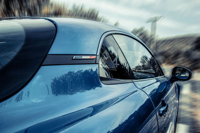 Close-up of car on side-view mirror