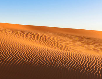 Scenic view of desert against clear sky