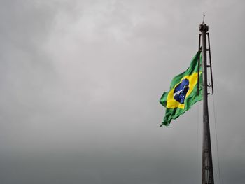 Low angle view of flag against sky