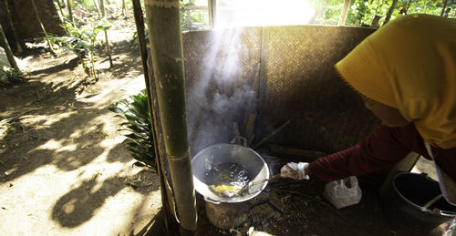 Midsection of man preparing food