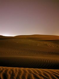 Scenic view of desert against clear sky