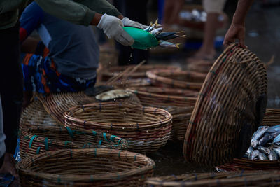 Buckets of fresh sardines fish at traditional seafood market, indonesia