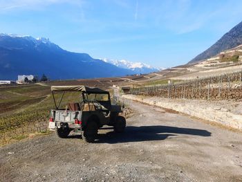 View of tractor on mountain against sky