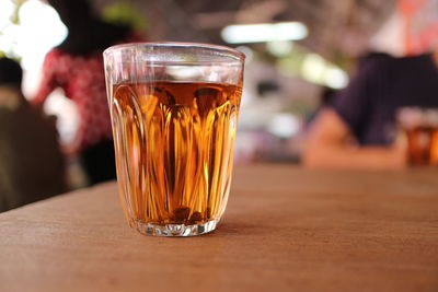 Close-up of beer glass on table