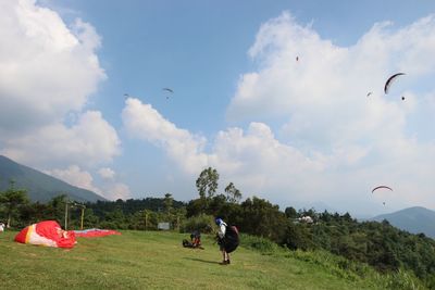 Scenic view of landscape against cloudy sky