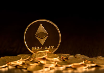 Close-up of coins on black background