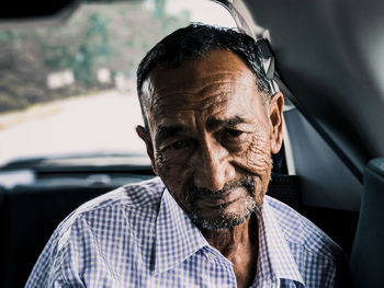 Portrait of man in car