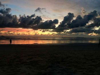 Scenic view of beach against sky during sunset