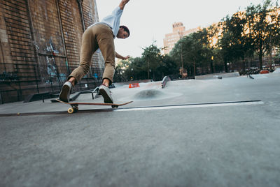 Full length of man skateboarding on skateboard