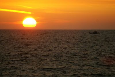 Scenic view of sea at sunset