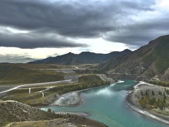 Confluence of rivers in altai. scenic view of lake against sky. 