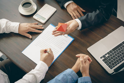 Midsection of business colleagues working at office