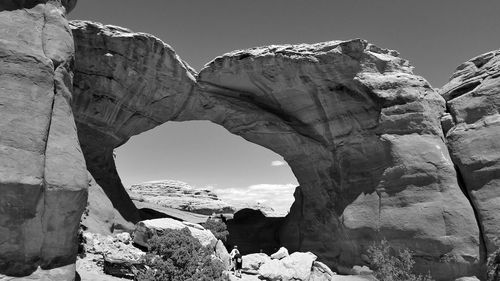 Low angle view of rock formation against sky