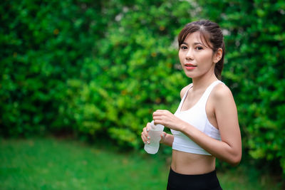 Young woman drinking water