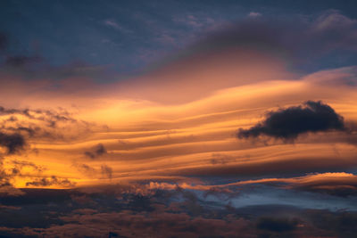 Low angle view of dramatic sky during sunset