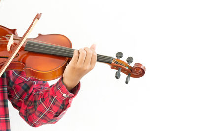Midsection of man playing guitar