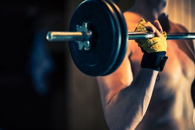 Midsection of woman exercising in gym