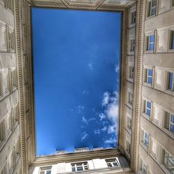 Low angle view of building against blue sky