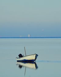 Lifeguard hut in sea against sky