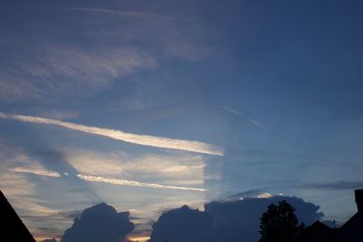 Low angle view of vapor trails in sky