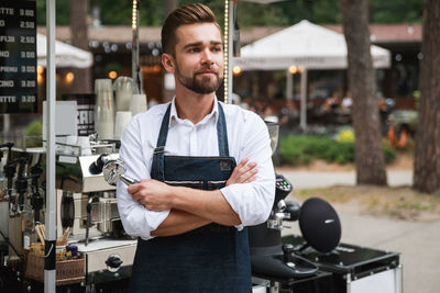 Barista looking away at stall