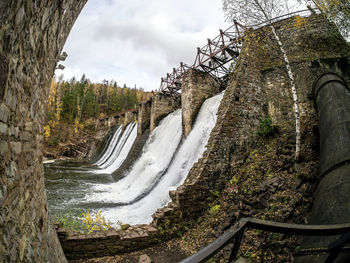 View of the dam on the bolshaya satka river in autumn, this is  the first power plants in russia 