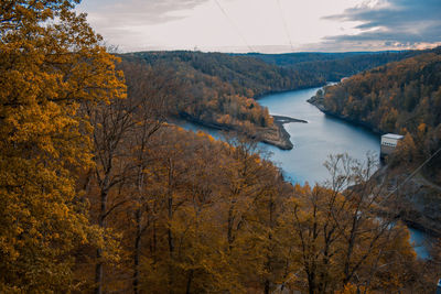 Scenic view of lake amidst trees against sky during autumn