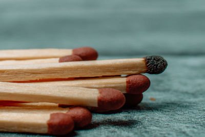 Close-up of matchsticks on table