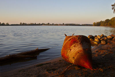 Scenic view of sea against clear sky and buoy 