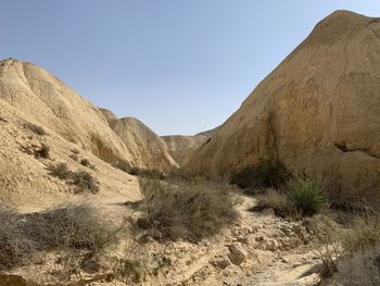 Scenic view of arid landscape against clear sky
