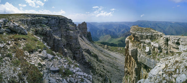 Panoramic view of rocky mountains against sky