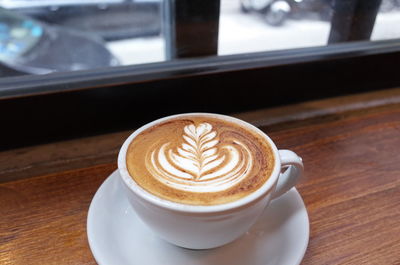 Close-up of cappuccino on table