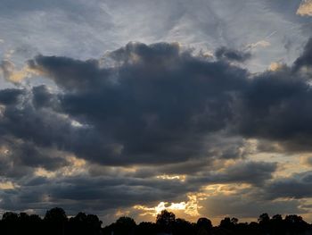 Low angle view of dramatic sky during sunset