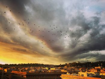 Cityscape against sky during sunset