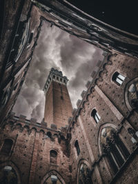 Low angle view of buildings in city against sky