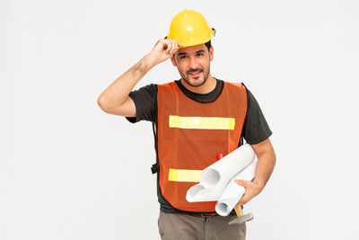 Man working against white background