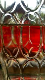 Close-up of red wine in glass on table