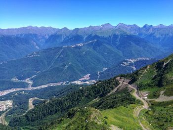 High angle view of mountains against clear blue sky