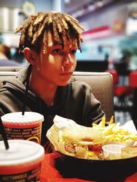 Mid adult man holding ice cream