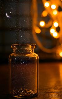 Close-up of glass bottle on table