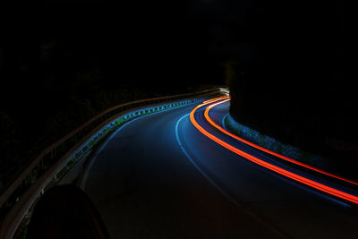 High angle view of light trails on road at night