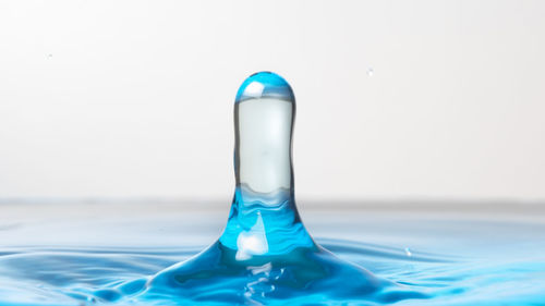 Close-up of water drop on glass